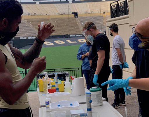 Drug Testing In Sports A group of people standing around a table