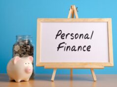What is personal finance? piggybank and full bottle of coins and board